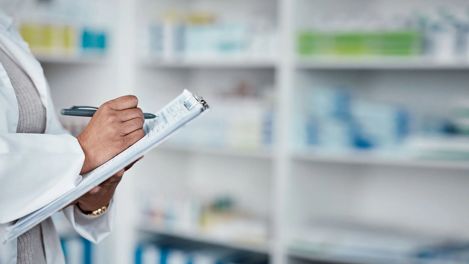 Toto2 0000s 0005 woman hands pharmacy clipboard writing medical stock check medicine product research pills prescription